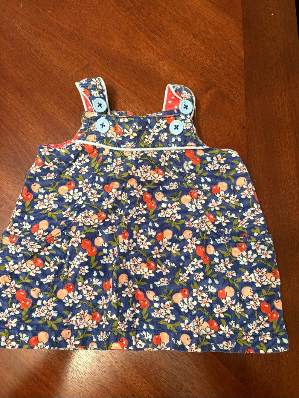 Baby Boden Navy Floral Corduroy Pinafore with Red Fruit Print